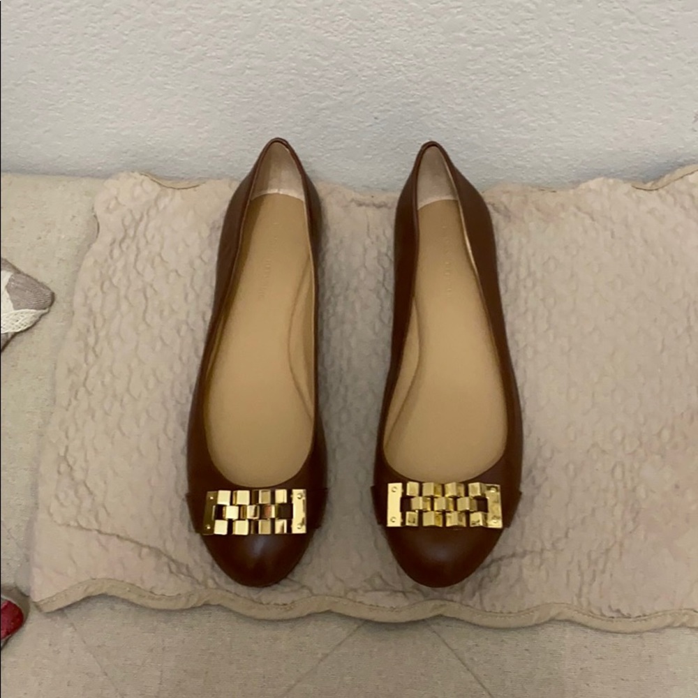 Brown leather flats.